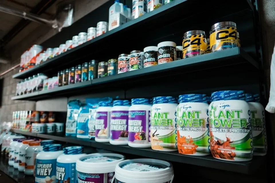 Rows of premium supplements and protein powders on shelves at Camperdown Nutrition